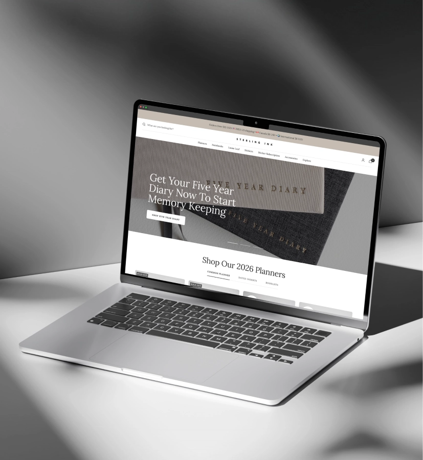Open laptop displaying a website for Sterling Ink featuring a Five Year Diary and 2026 planners.